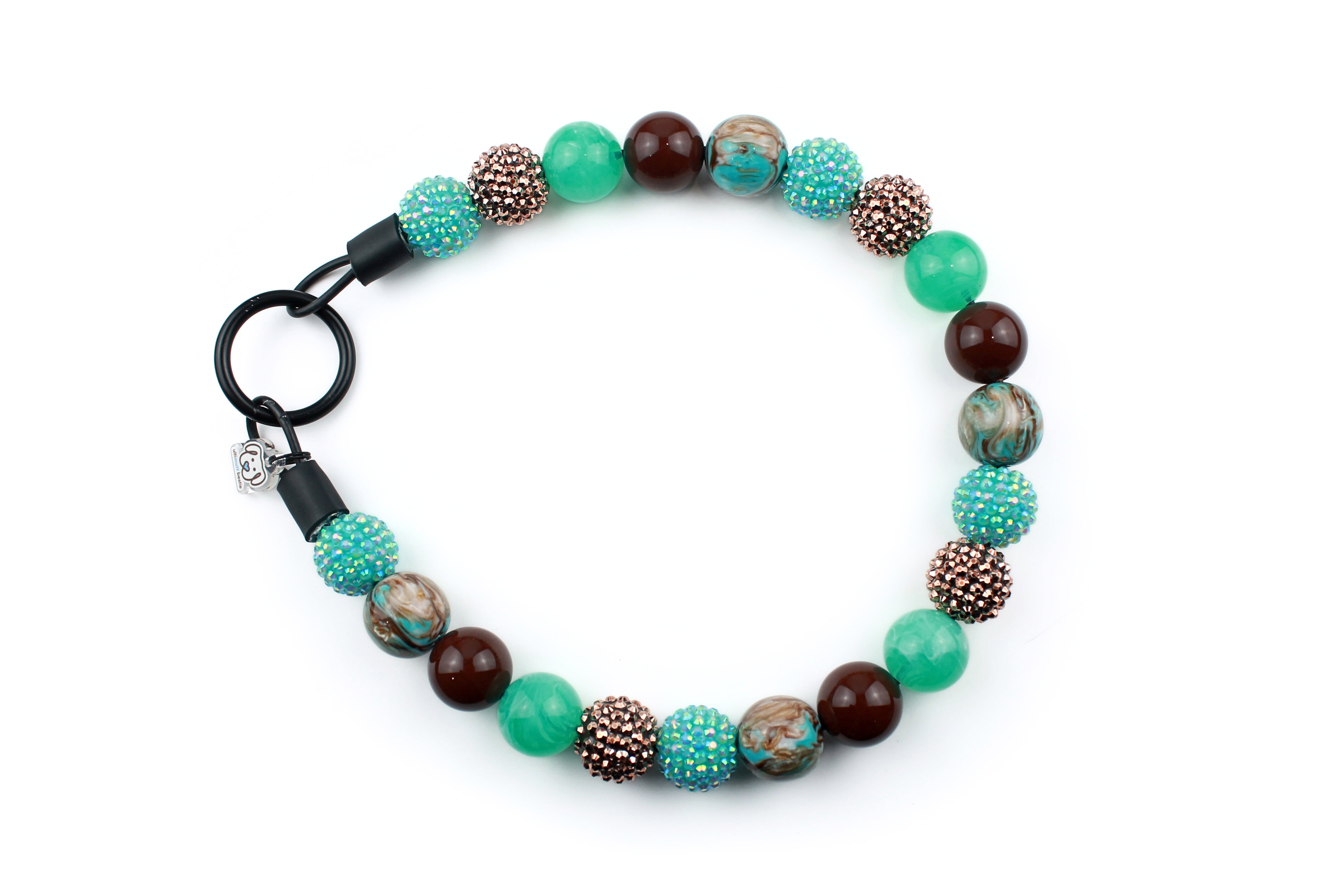20mm aqua marine marble, brown solid, Aqua and cooper rhinestones, brown with blue resin swirl beads with black o-ring closure. Slip on style.