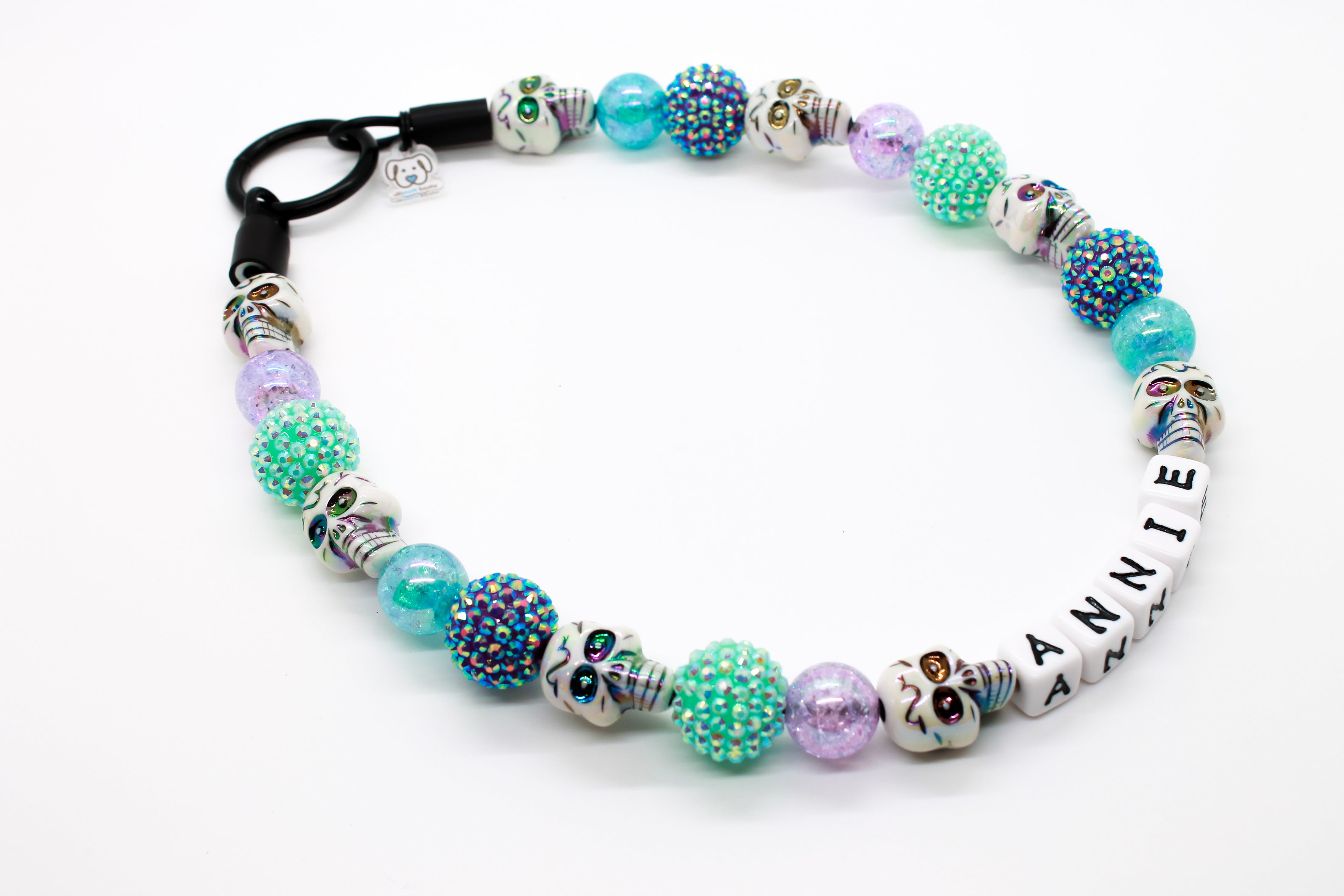 Pastel Skull bead dog collar, side view, aqua and purple miracle and rhinestone beads with iridescent white skulls.