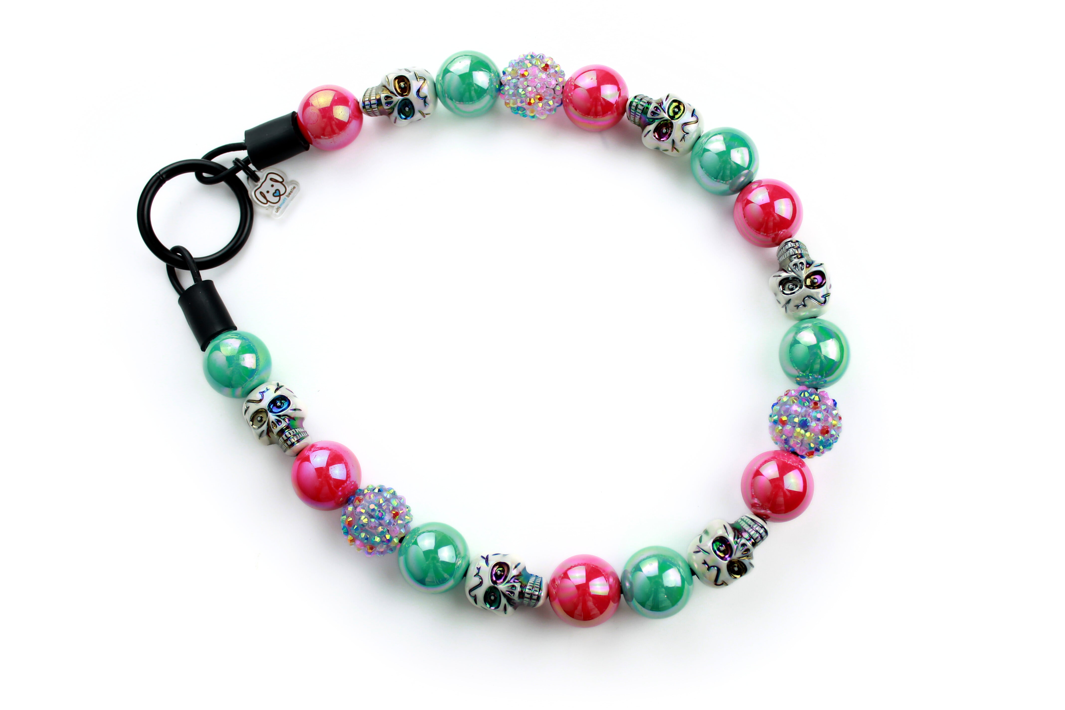 Hot pink and aqua miracle beads with iridescent white skulls