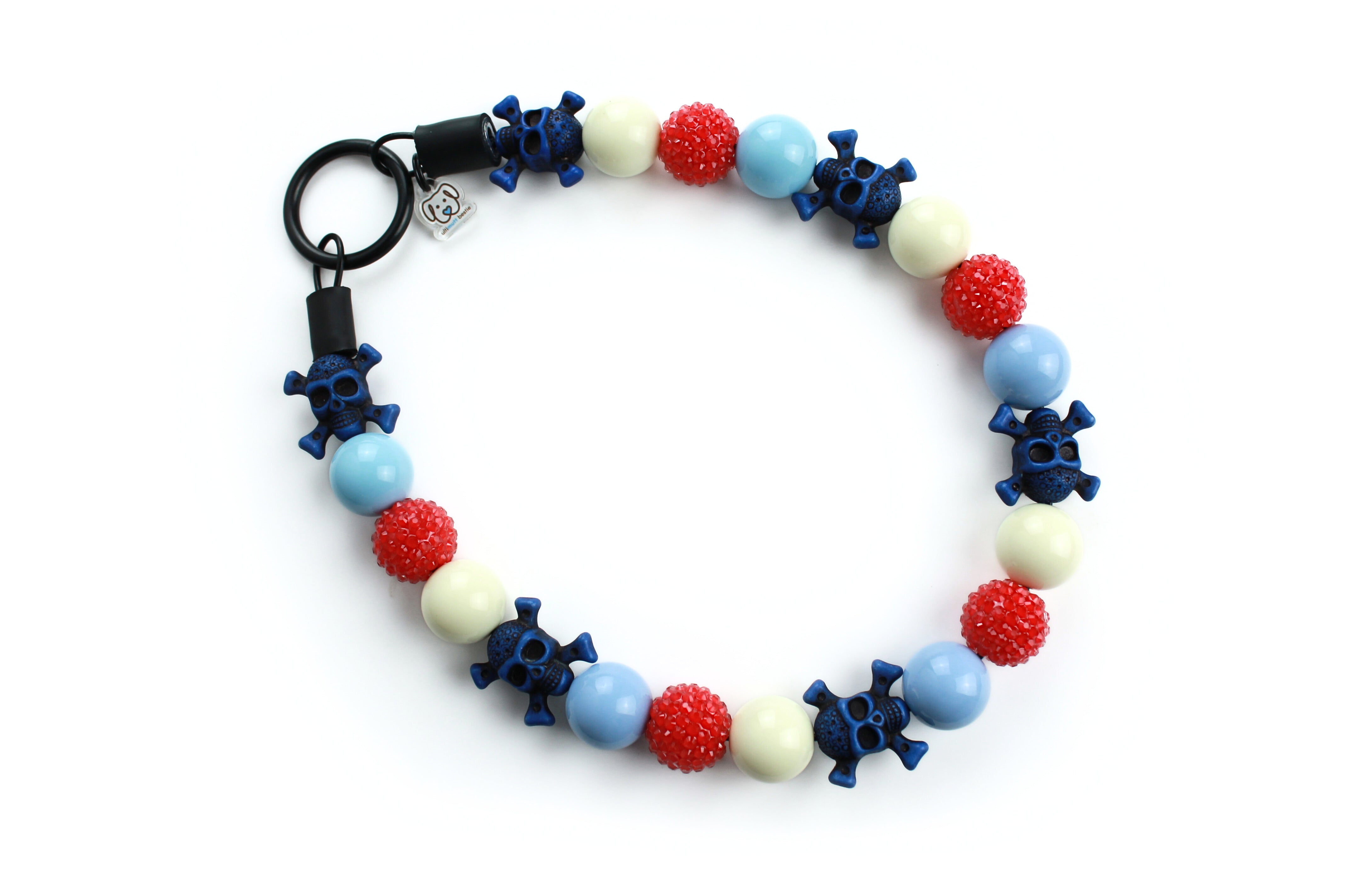 Large beaded dog collar,  cream, baby blue, navy blue skulls with crossbones and red jelly rhinestone beads .